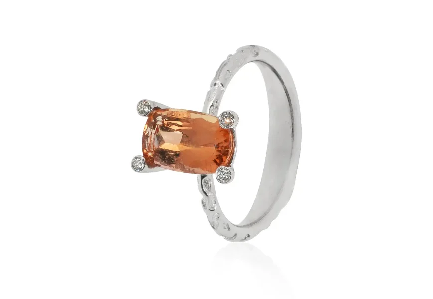 White gold ring with imperial topaz