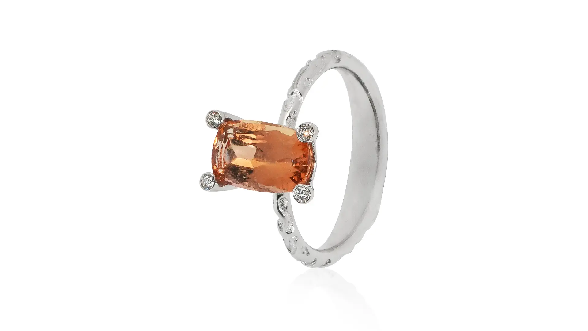 White gold ring with imperial topaz